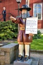In front of the Karlskrona Admiralty Church the wooden figure Rosenbom collects money for the poor. A money box is located under Royalty Free Stock Photo