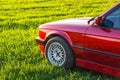 Front left side of an old German car that stands on green grass Royalty Free Stock Photo