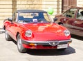 Front left side view of vintage classic red retro automobile car parked in a street of Lecce Royalty Free Stock Photo