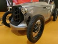 Front left view of silver electric version of stylish microcar roadster Patak Rodster