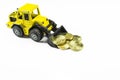 Front loader toy with money Royalty Free Stock Photo