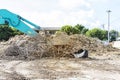 Front loader truck clearing concrete wast and steel at construction site Royalty Free Stock Photo