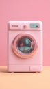 Pastel Pink Washing Machine on Seamless Background, a Modern Appliance For Clean Laundry Royalty Free Stock Photo