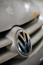 Front logo of a parked silver colored Volkswagen Golf Plus 2006 in a parking lot Royalty Free Stock Photo