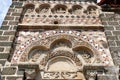 Frieze and Tympanum sculpted above the entrance to the Saint-Michel chapel at the top of the Aiguilhe rock near Le Puy-en-Velay