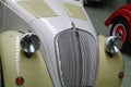 Front mask of creamy white and beige coloured oldtimer Italian city car Fiat 500 Topolino little mouse launched in 1936