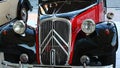 Front mask detail of veteran french automobile Citroen Traction Avant BL11 from year 1959, red and black coloured