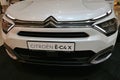 Front mask and healdights of modern french battery electric compact family crossover SUV car Citroen E-C4 X