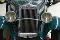 Front mask of small veteran 2-door 2-seater italian cabriolet car Fiat Balilla Spider from year 1933, dark green colour