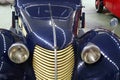 Front mask of veteran Czechoslovak car Aero 30 from year 1939, deep blue colour. Royalty Free Stock Photo