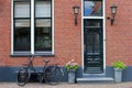 Front of Dutch brick wall house and vintage bike, Netherlands Royalty Free Stock Photo