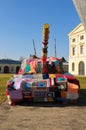 In front of the military history museum in Dresden city there is a colourfull peace tank as a protest against war world wide