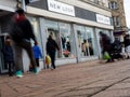 The front of a New Look store with people caught blurred in motion Royalty Free Stock Photo
