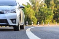 Front of new silver car parking on the asphalt road Royalty Free Stock Photo