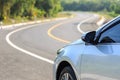 Front of new silver car parking on the asphalt road Royalty Free Stock Photo