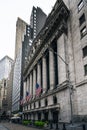 Front of the 1908 New York Stock Exchange on Broad Street with American flags on a front Royalty Free Stock Photo