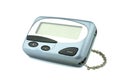 Front old a cyan metallic pager or beeper on white floor and background, isolated with clipping path. Royalty Free Stock Photo