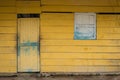 Front of old wooden house - yellow, vintage wooden hut