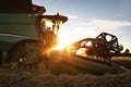 Front part of a combine at sunset