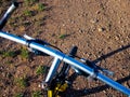 Front part of a mountain bike with its handlebars and front wheel on a dirt road in nature Royalty Free Stock Photo