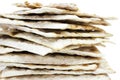 A front photo of many pieces of matzah or matza isolated on white background. Matzah for the Jewish Passover holidays. Selective s