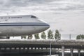 Front of a plane driving over a runway bridge