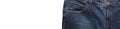 Front pocket, waist area, zipper, and its button of dark blue jeans isolated on white background. Close up shot. Copy space. Royalty Free Stock Photo