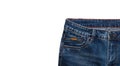Front pocket, waist area, zipper, and its button of dark blue jeans isolated on white background. Close up shot. Copy space. Royalty Free Stock Photo