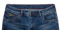 Front pockets, waist area, zipper, and its button of dark blue jeans isolated on white background. Close up shot. Clothing concept Royalty Free Stock Photo