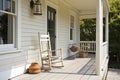 front porch of cape cod house, with rocking chair and lantern, providing a cozy and inviting space Royalty Free Stock Photo