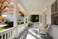 front porch of colonial revival house with gambrel roof