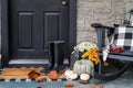 Front Porch Decorated for Autumn with Buffalo Plaid