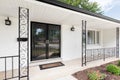 A front porch detail of a white home. Royalty Free Stock Photo