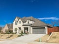 Front porch entrance of newly built 2-story house with attached