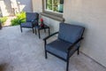 Front Porch Of House With Two Chairs & Striped Cushions Royalty Free Stock Photo