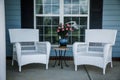 Front Porch Relaxation Wicker Chairs and Flowers Royalty Free Stock Photo