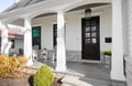 Front porch of a white modern farmhouse.