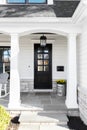 Front porch of a white modern farmhouse.