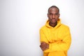 Front of cool african american man in hoodie against white wall Royalty Free Stock Photo