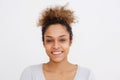 Front portrait of young african american woman smiling against white background Royalty Free Stock Photo