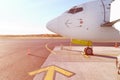 Front profile and cockpit windows of wide-body airplane.