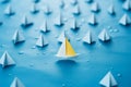 Front runner blue paper boat guides a formation of white vessels Royalty Free Stock Photo