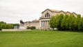 The front of the Saint Louis Art Museum with the sculpture titled `Apotheosis of St. Louis and row of bald cypress trees.