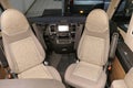 Front seats turned backwards into dining position in modern premium german camper van Carthago Malibu 450 Light Royalty Free Stock Photo