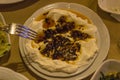 Front shot of traditional tasty yogurt ingridient appetizer for turkish drink of raki in night dinner at Izmir in Turkey