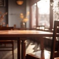 Front side of empty wooden table for product display, blurred cafe interior background. Warm and calm evening ambiance with