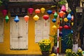 Front side of a small house with beautiful colored paper lantern lamps on the streets of Hoian historic town. Hoi An, Vietnam -
