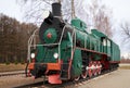 Front side view of classic old green soviet steam locomotive with red star Royalty Free Stock Photo