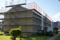 Front and side view on residential apartment house in Switzerland with scaffolding. Royalty Free Stock Photo