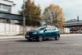 Front side view rolling shot with Dacia Sandero Stepway subcompact car second generation B52. Fast moving Marine Blue small